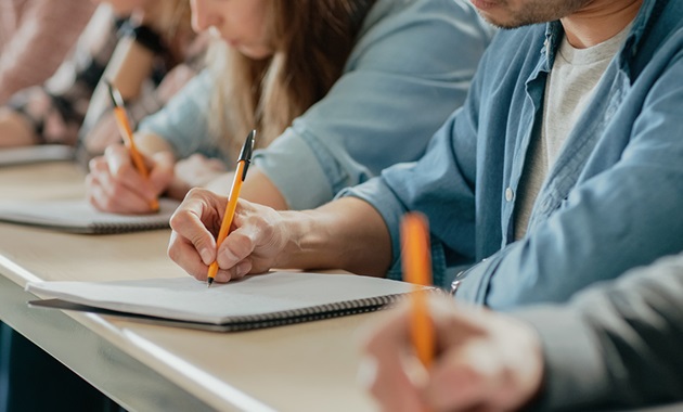 Students writing in their exam