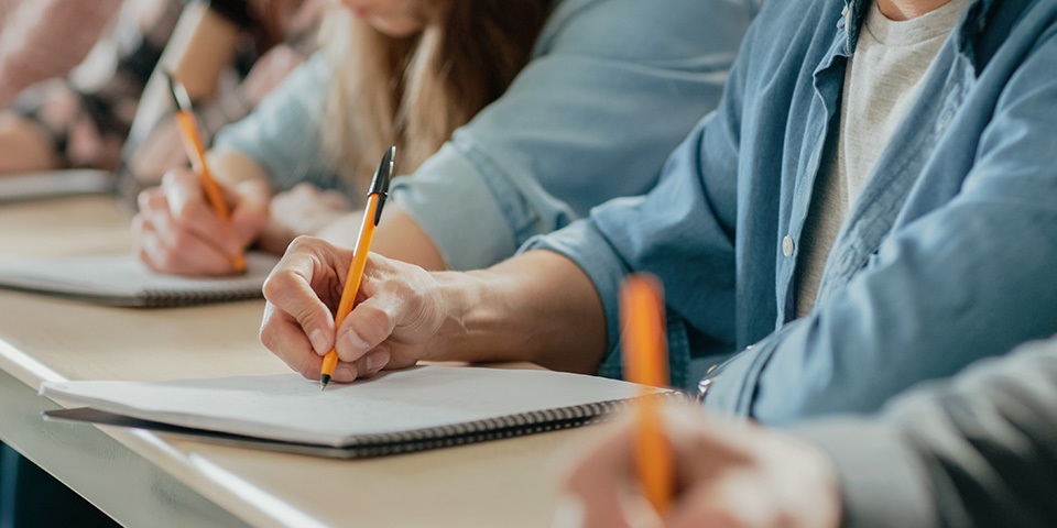 Students writing in their exam
