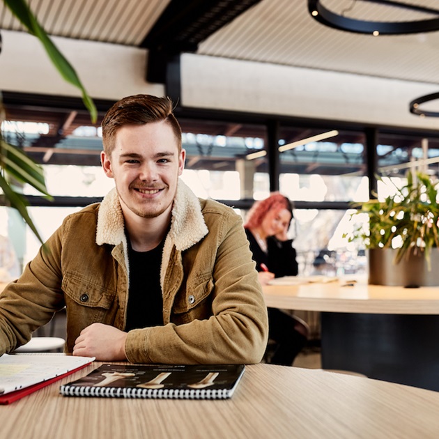 student smiling in hub