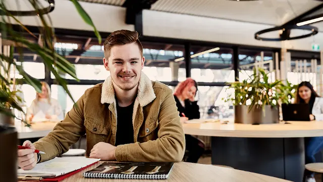 student smiling in hub