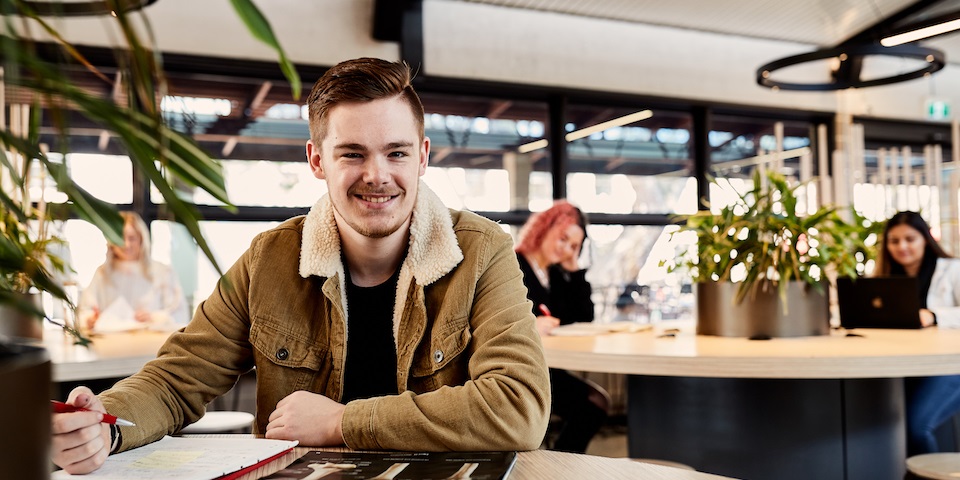 student smiling in hub