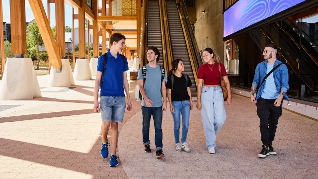 BK exterior, five students walking