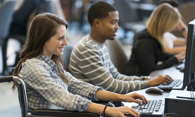 students looking at computer