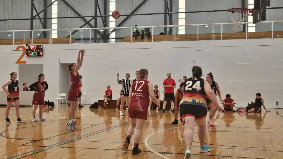 Female shooting basketball