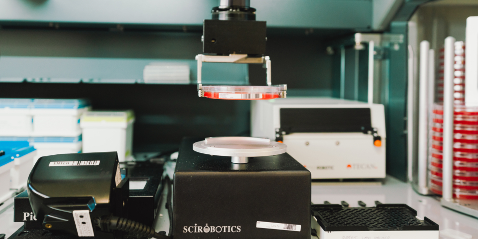 A robot picking up a sample to test it