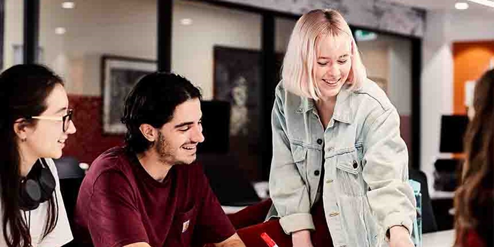 Creative Arts Students Feature Image Group of people studying at a desk