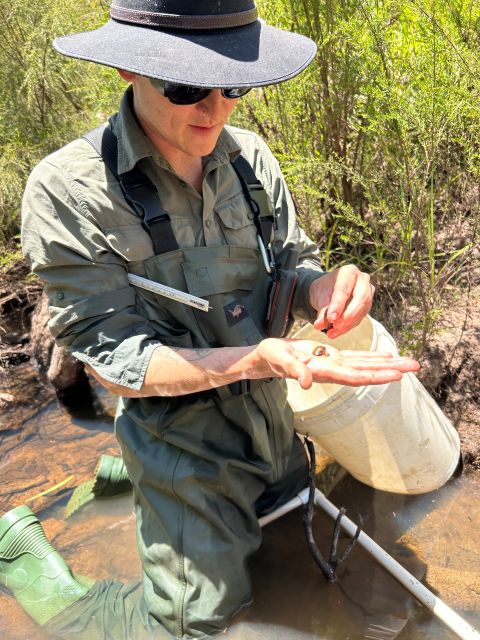 Dr Daviot Dr Jake Daviot holding a freshwater mussel