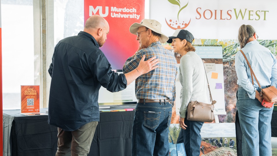 SoilsWest researchers speaking with growers at the Dowerin Machinery Field Days SoilsWest researchers speaking with growers at the Dowerin Machinery Field Days.