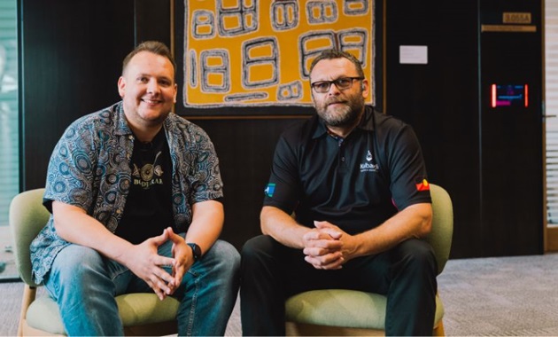Dylan Collard and Aaron Taylor sitting side-by-side, smiling