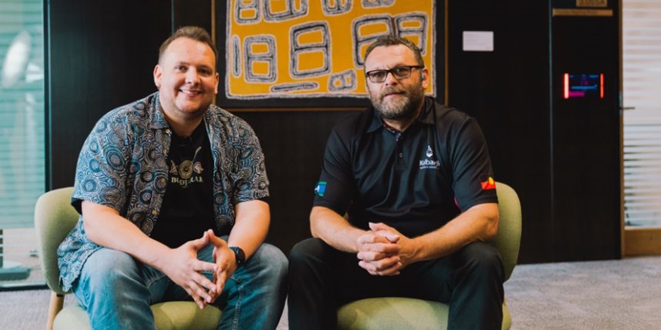 Dylan Collard and Aaron Taylor sitting side-by-side, smiling