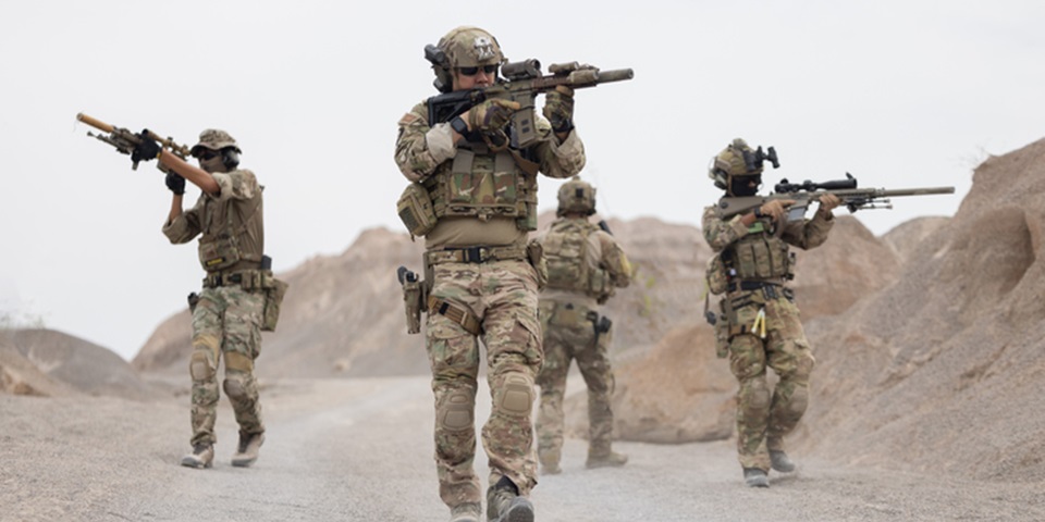 Soldiers on a patrol in Afghanistan. (Credit: charnsitr/Getty Images)