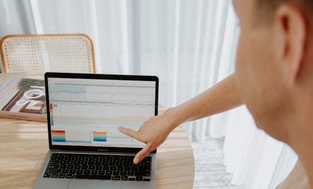 Man monitoring his heart rate on a laptop