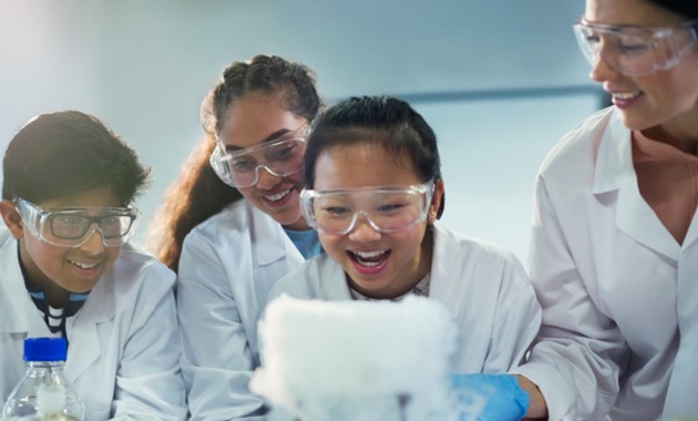 high school students doing science experiment