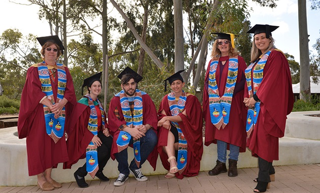 Aboriginal graduates don Indigenous sash