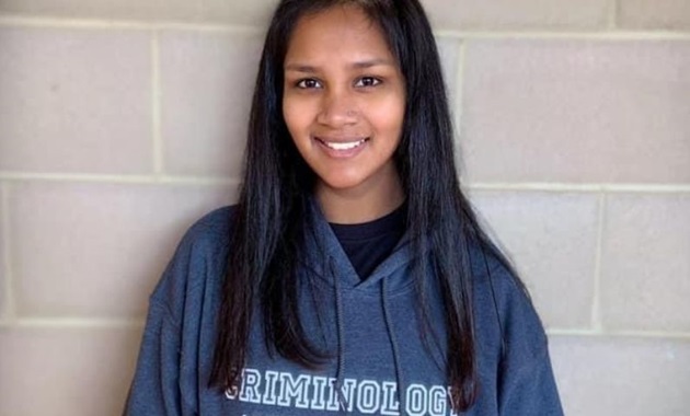 Student smiles in Murdoch hoody