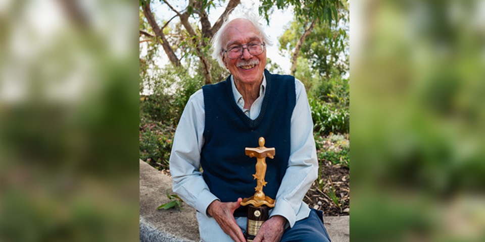 Jim Warren with award