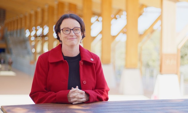 Linda Tammen sitting at a table at Boola Katitjin