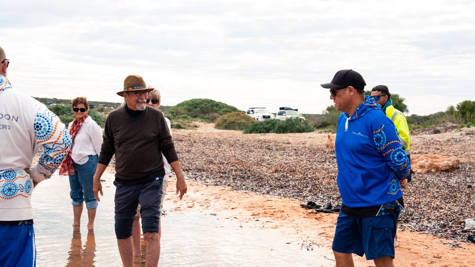 Michael Wear and Daniel Wildcat. Michael Wear and Daniel Wildcat wading in the shallows in Shark Bay.