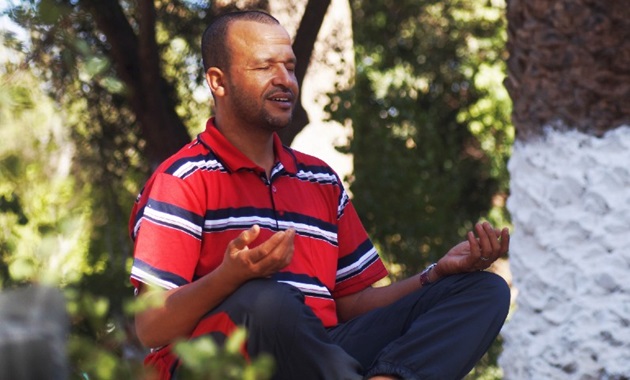 man meditating outdoors