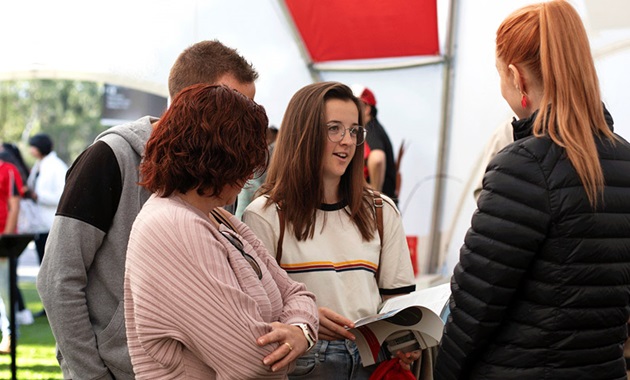 Parents with their child talking to an advisor at Murdoch