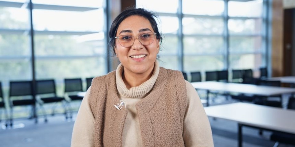 PhD candidate Mina Ardakani smiling at the camera