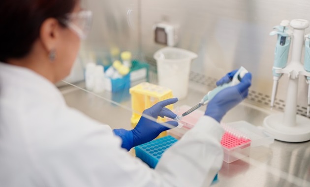 Dr May Aung-Htut working in a lab at the Personalised Medicine Centre
