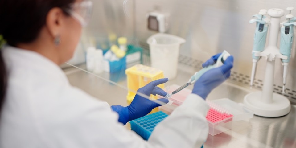 Dr May Aung-Htut working in a lab at the Personalised Medicine Centre
