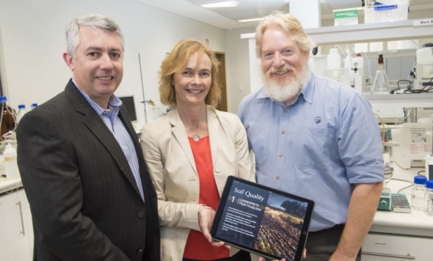 Professor Daniel Murphy, Dr Fran Hoyle and Chris Gazey pictured with Soil Quality ebook 1 Constraints to Plant Production in 2016. Credit DPIRD.