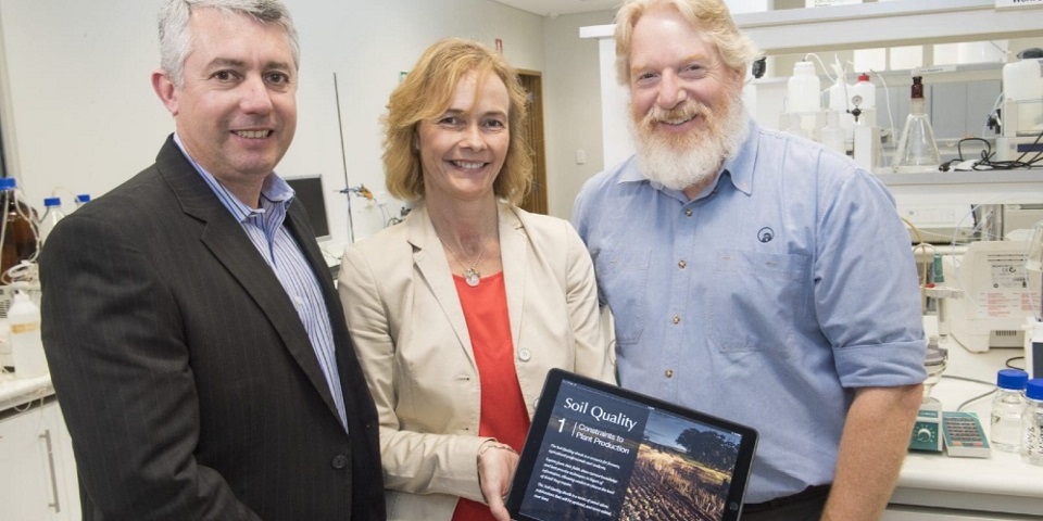Professor Daniel Murphy, Dr Fran Hoyle and Chris Gazey pictured with Soil Quality ebook 1 Constraints to Plant Production in 2016. Credit DPIRD.