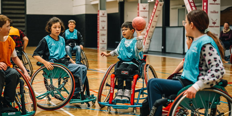 Kids playing handball in wheelchairs at Murdoch Active gym
