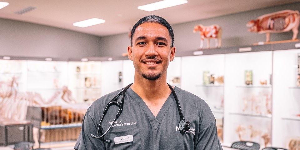 Roy Curion standing in Murdoch Vet Museum.