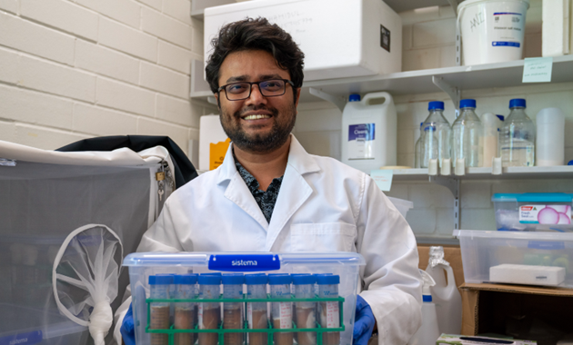 Headshot of PhD student Shahidul Khan in his lab coat.