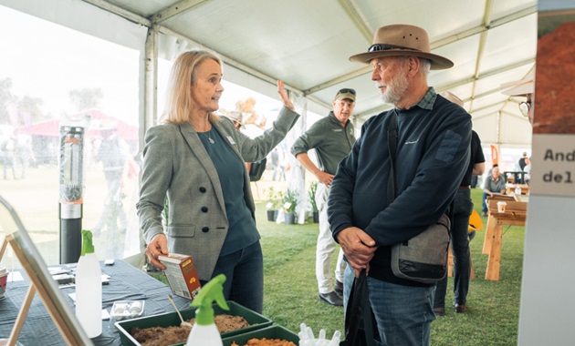 Fran Hoyle talking to a grower about the value of soils knowledge.