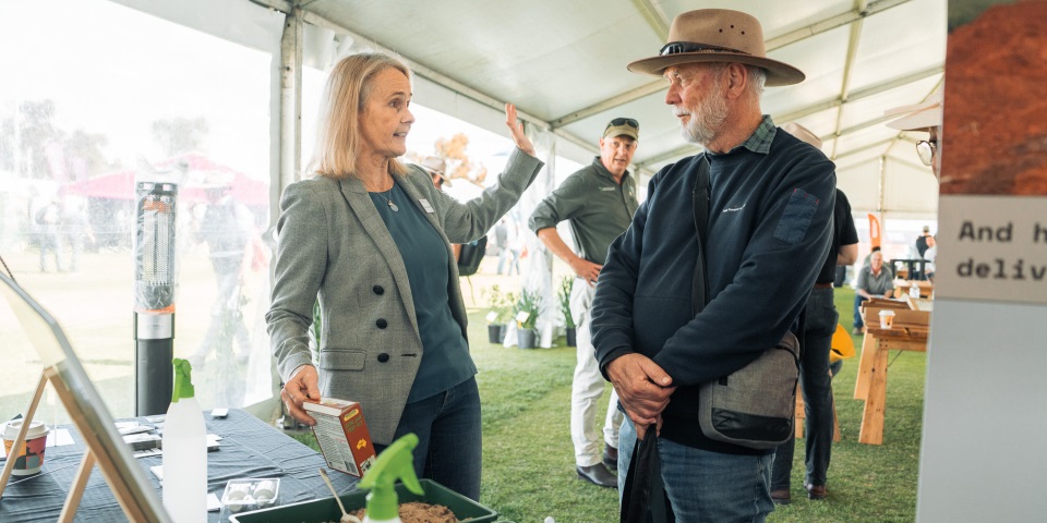 Fran Hoyle talking to a grower about the value of soils knowledge.