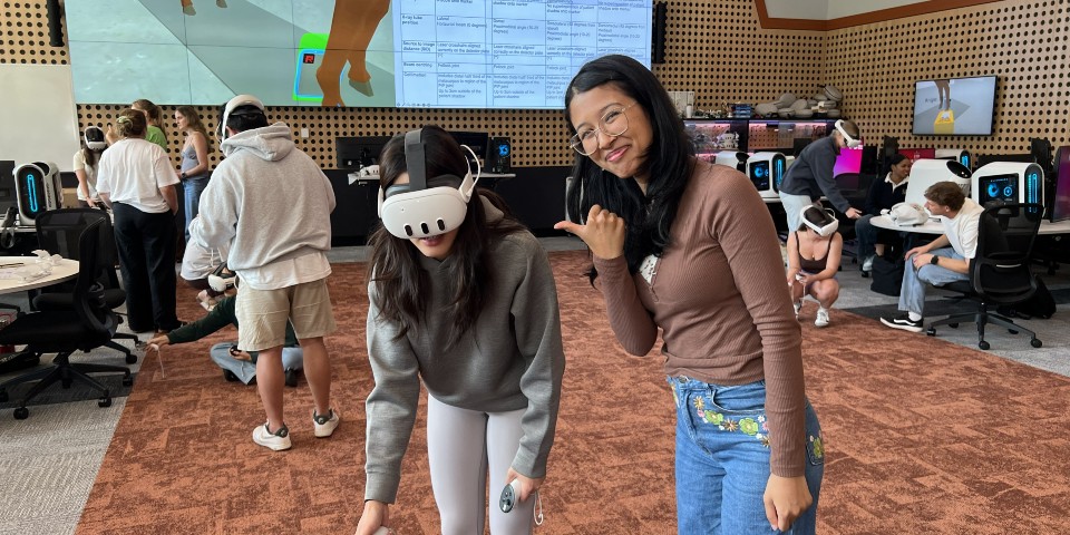 Two students wearing VR headset.