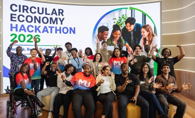 Members of the winning team of the 2026 Circular Economy Hackathon pose together in a group, smiling.