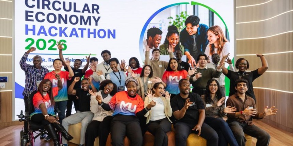 Members of the winning team of the 2026 Circular Economy Hackathon pose together in a group, smiling.