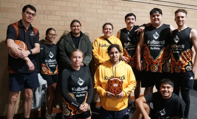 Kulbardi team together holding the state UniSport competition shield