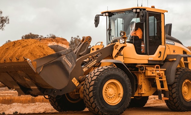 Man sitting in a mining tractor.