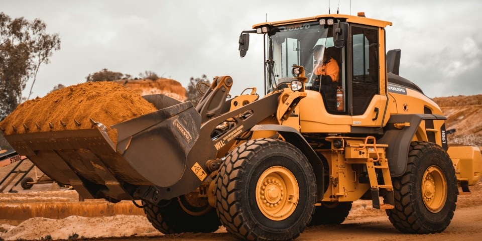 Man sitting in a mining tractor.