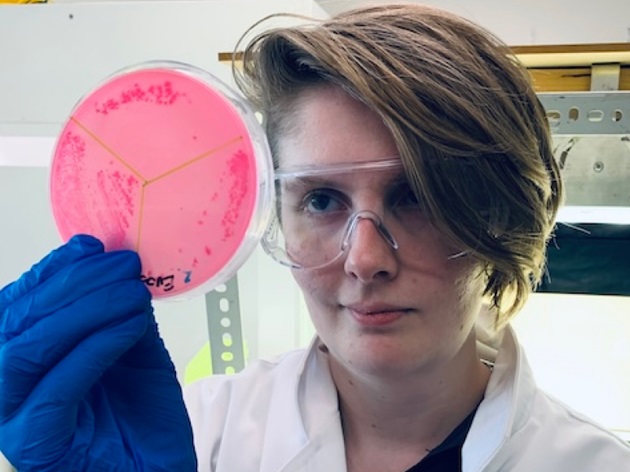 BIH researcher with sample