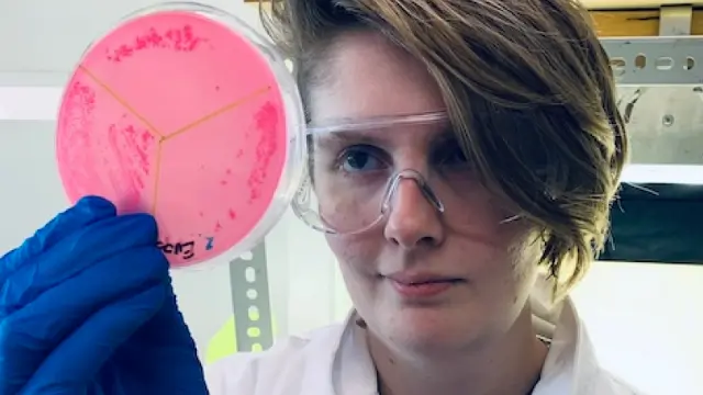 BIH researcher with sample