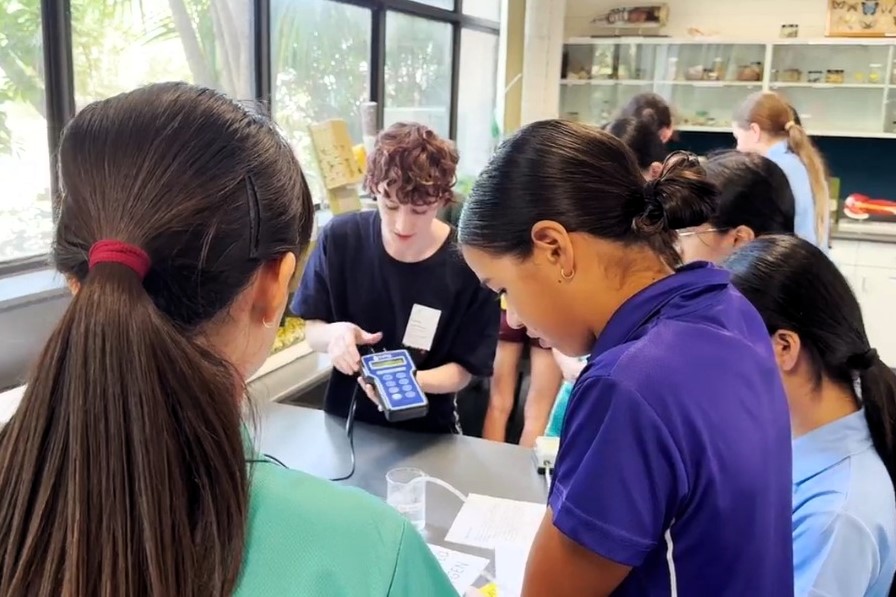 St Marys student learning to use a water monitor with Kiera Gordon
