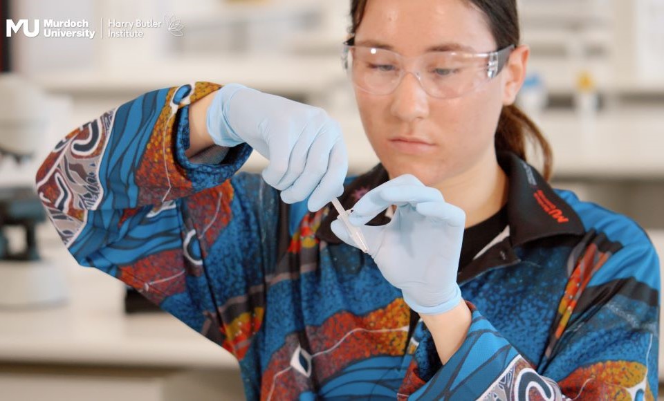 Charlize preparing a sample for DNA processing