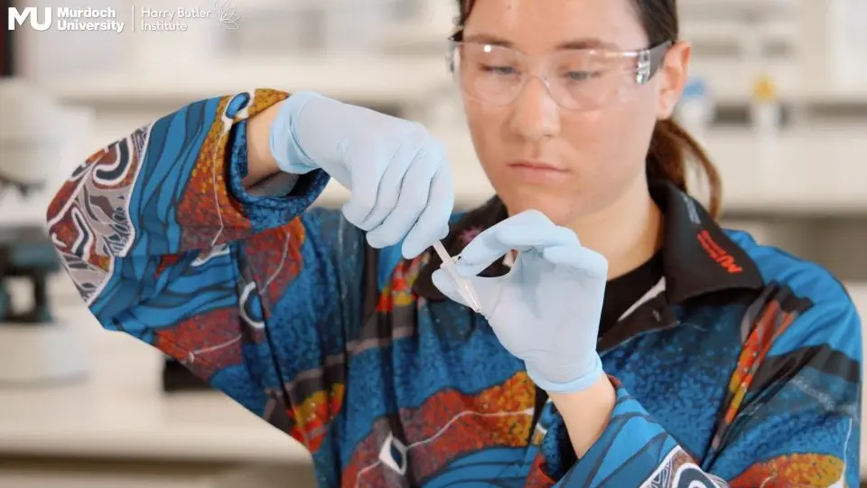 Charlize preparing a sample for DNA processing