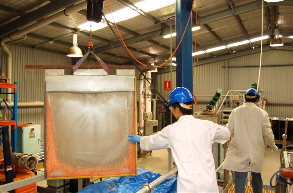 HBI researchers operating industrial equipment