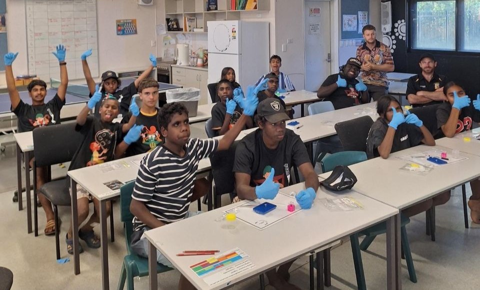 Students at their desks answering questions