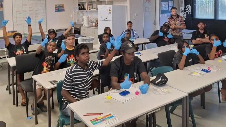Students at their desks answering questions