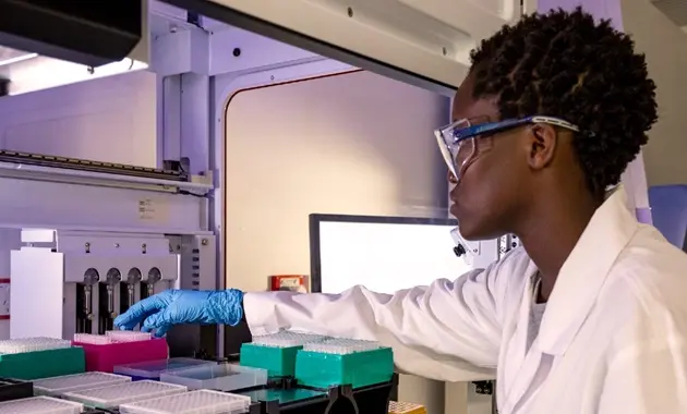 Reseaecher using lab equipment