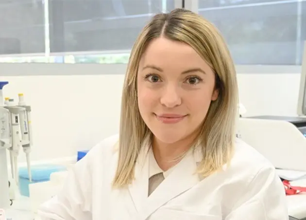 Female researcher smiling at camera
